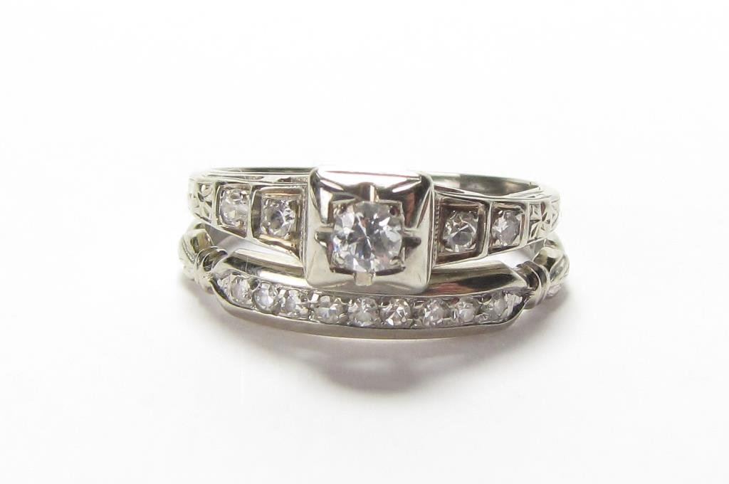 18K White Gold Diamond Wedding Set: An 18K white gold wedding set, size 5.5, wedding ring with approximately .50ct round solitaire diamond with four accent diamonds and diamond wedding band