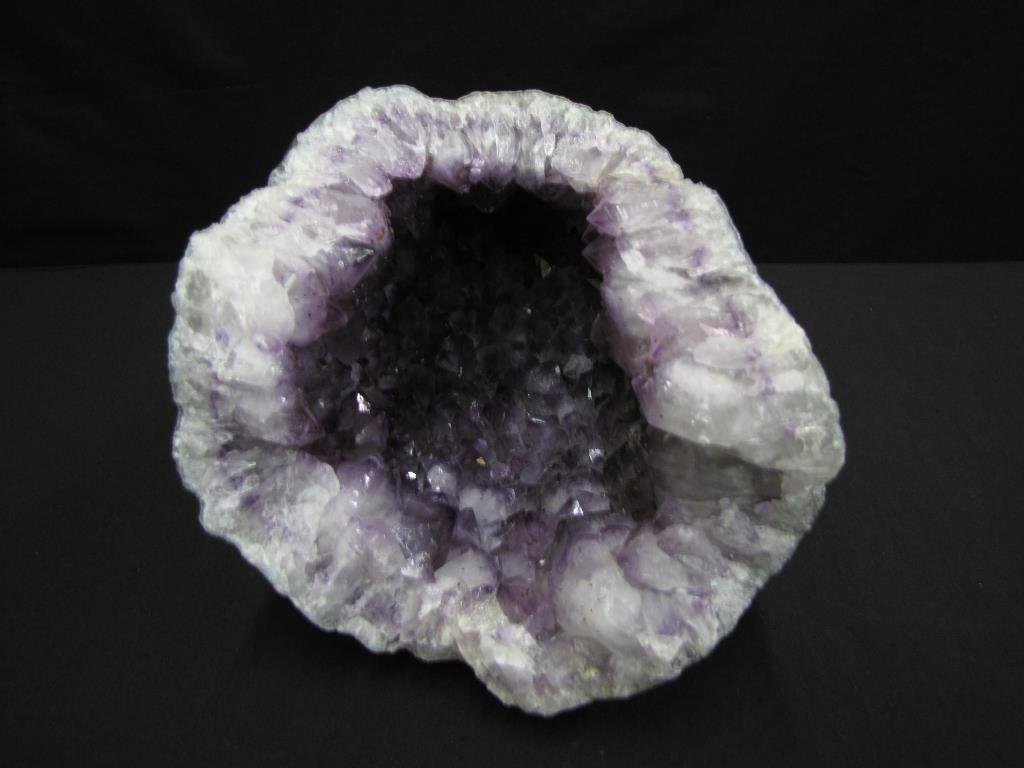 Large Brazilian Amethyst Crystal Geode: Large Brazilian Amethyst Crystal Geode, unpolished raw geode with excellent color and depth to the crystals, 14.5" x 9.5" x 9"