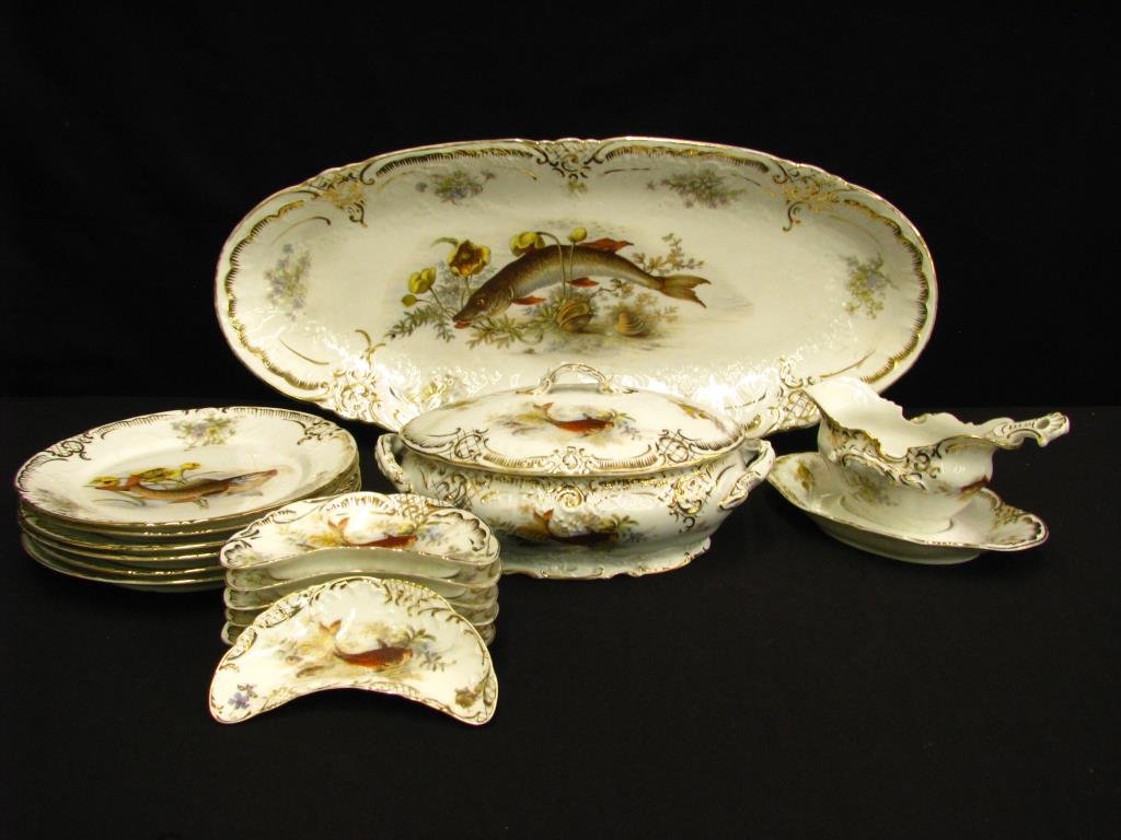 Antique English Porcelain Fish Set: Antique English Porcelain Fish Set including: six plates, six bone dishes, platter, gravy boat and lidded tureen with ladle, transferware images depicting various varieties of fish, unsigned, platter 