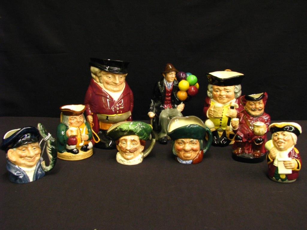Group of Royal Doulton Toby Mugs and Figurine: Group of Royal Doulton Toby Mugs and Figurine, eight mugs including: "The Huntsman", "Jolly Toby", "The Town Crier", "Falstaff", "Honest Measure", "Lobster Man", "The Cavalier", "Toby Philpots", one "