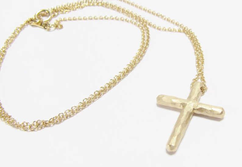 Tiffany Paloma Picasso 18K Cross Necklace: A Tiffany 18K yellow gold cross, by designer Paloma Picasso, on 18K chain