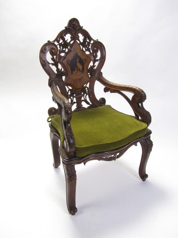 Walnut Victorian Transitional Arm Chair: An antique Victorian transitional arm chair, walnut frame with ebonized accents, inlaid back panel with mountain goat decoration, solid wood seat, 27x24x46"h