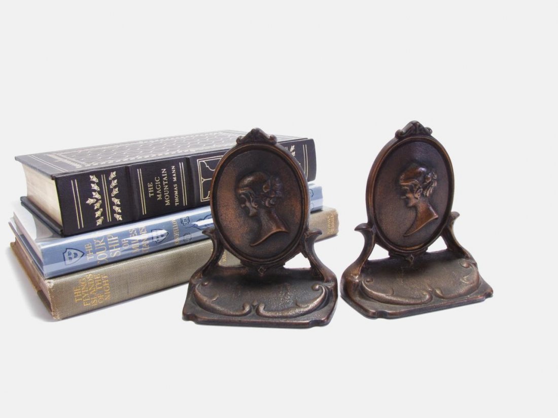 Bronze Bookends and Books: Bronze Bookends and Books, pair of bronze bookends, depicting bust of woman, 4.75" tall, three books including: "The Magic Mountain" by Thomas Mann, "The Courtship of Miles Standish" by Henry W. Longf