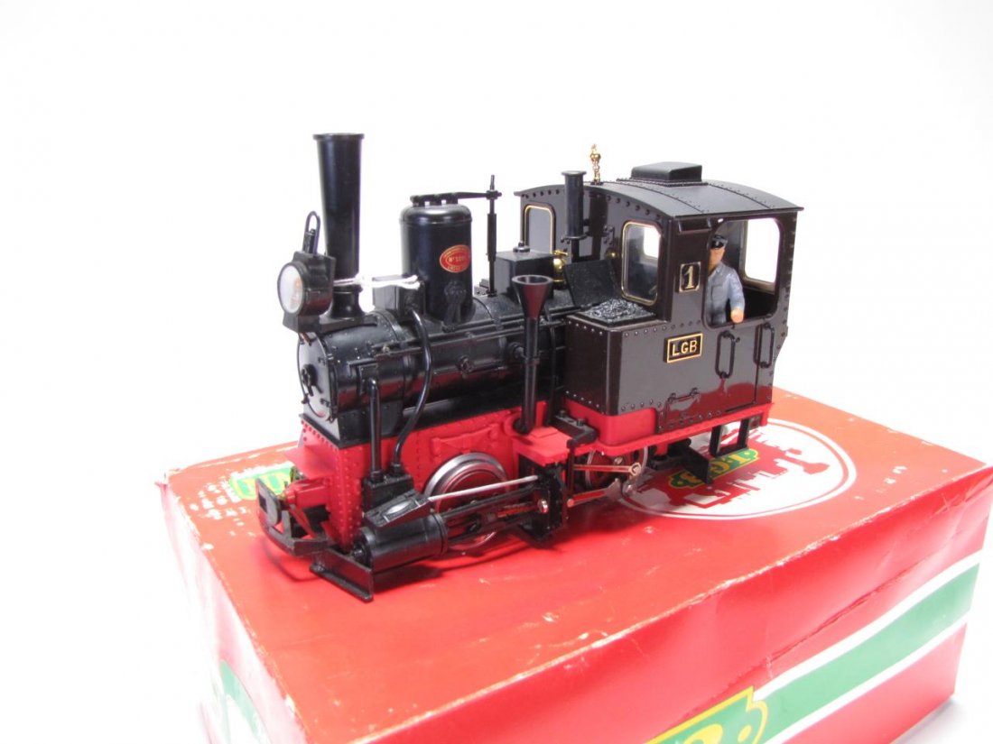 LGB G Scale #2010 Black Locomotive: LGB G Scale #2010 Black Locomotive, with lighted headlight and end lights, measuring 10" long, repairs made to both connectors and one rail, with original box marked "used"