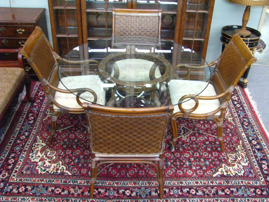 Hooker Casual Dining Set: A Hooker furniture casual dining set, with four rattan and aluminum arm chairs, and matching beveled glass top table, having ball and talon foot on single pedestal, 54"dia, chairs 39"h