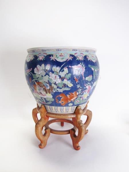 Oriental Porcelain Fish Bowl: Oriental Porcelain Fish Bowl, blue ground with floral, bird and insect decoration, 25.5" high with wooden stand