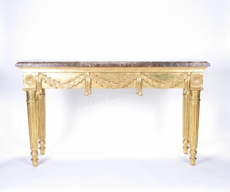 Palazzo Italian Console, Charles Pollock: A decorator-quality, Pallazo Italian console, 24K gold gilded carved frame with reeded column leg and swag and tassel motif, made by Charles Pollock Reproductions, USA, 63x21x36"h