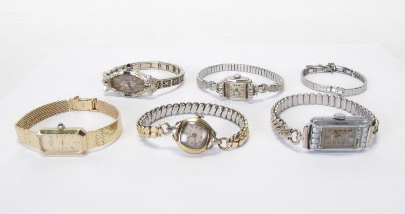 Five Vintage Lady's Watches: Five vintage lady's watches including a Brunvil Watch Co. 15-jewel, three adjustment in Bruner 1/10 gold filled case, with a LaPetite stainless back band; a Seiko 14K yellow gold watch and 14K yellow