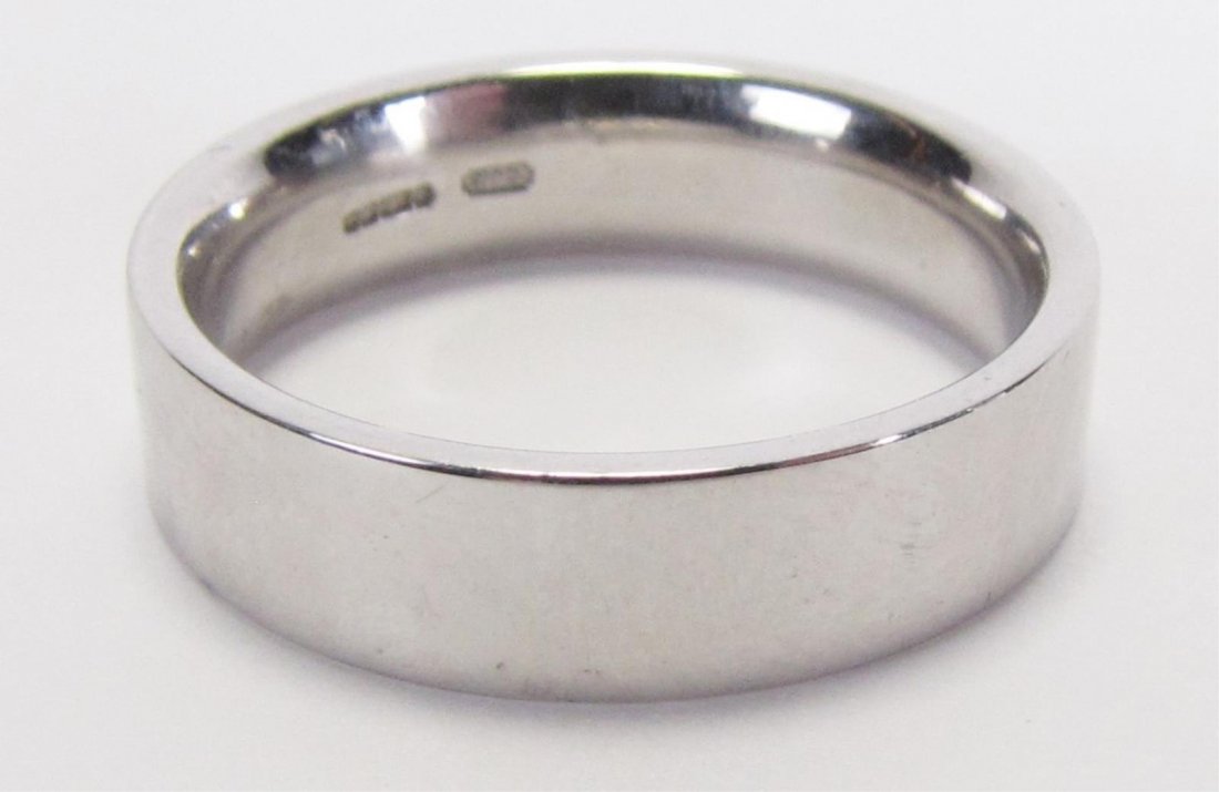 English Platinum 950 Pipe Cut Band: An English 950 platinum pipe cut style band, marked CJLd, with DOM sponsor mark, hallmarks reflect Birmingham Assay office, post 1972 (International Convention hallmark), size 8.25, 7.3dwt