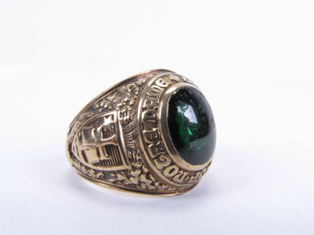 10K Yellow Gold Notre Dame Class Ring: 10K yellow gold Notre Dame class ring with oval cabochon Celtic green stone, stone with chips and scratches, personal inscription interior (illegible), size 9.5, 15.8dwt, with Notre Dame jewelry box
