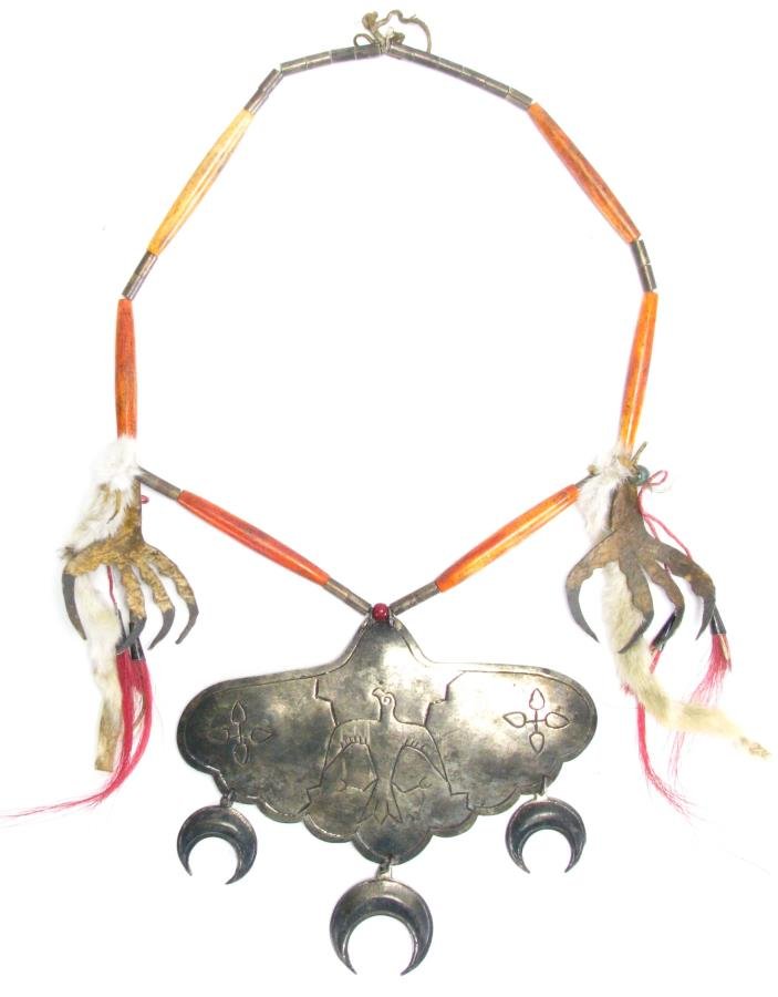 Cheyenne War Chief Silver Gorget Necklace: Cheyenne War Chief Silver Gorget Necklace, antique silver and carved bone necklace with rawhide talon and rabbit fur decoration, large silver gorget with three hanging moons and embossed eagle decorat