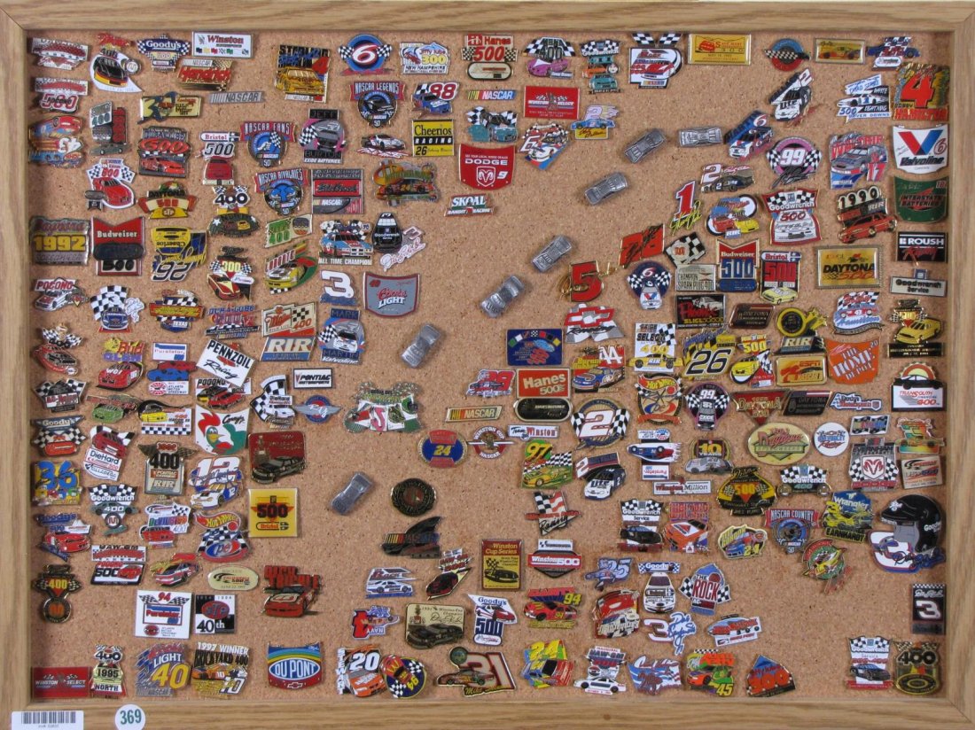 Collection of Racing Pins: Collection of Racing Pins, approximately 150 pins, depicting Nascar courses from around the country, sponsor and driver pins, mounted on corkboard, 18" x 25"
