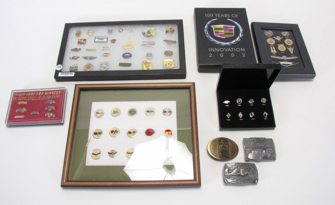 Collection of Racing Pins and Belt Buckles: Collection of Racing Pins and Belt Buckles, 71 total including: 15 Corvette pins in display case; 8 Renault pins in case; 10 Cadillac pins in case; seven car pins from past Indianapolis 500 winners, 1