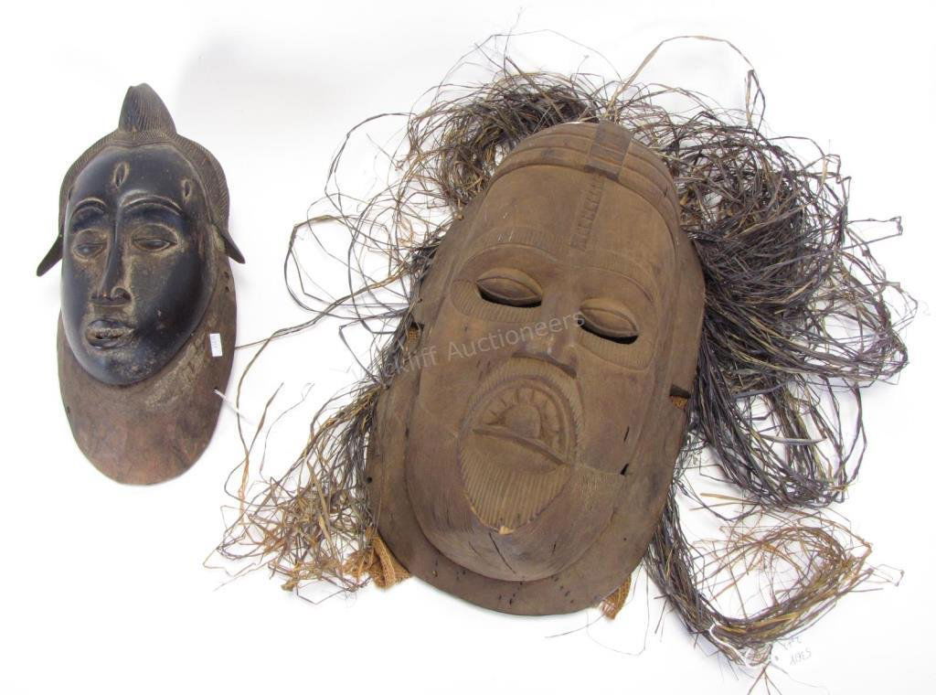 Two African Tribal Ceremonial Masks: Two African Tribal Ceremonial Masks, Guro Tribe Ceremonial Mask, carved wooden mask having a long narrow nose, three point hairstyle, pierced mouth; Dan tribe mask from the Ivory Coast, concave face w