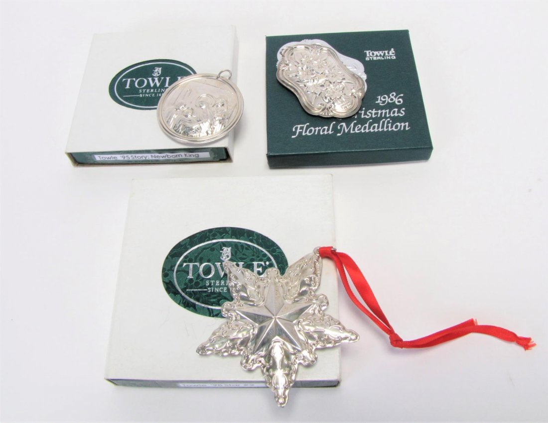 Three Towle Sterling Annual Ornaments: Three Towle sterling annual ornaments, including 1986 "Floral Medallion"; 1995 "Newborn King"; 1998 "Second Edition Silver Star", all with original boxes, 2" - 3" long