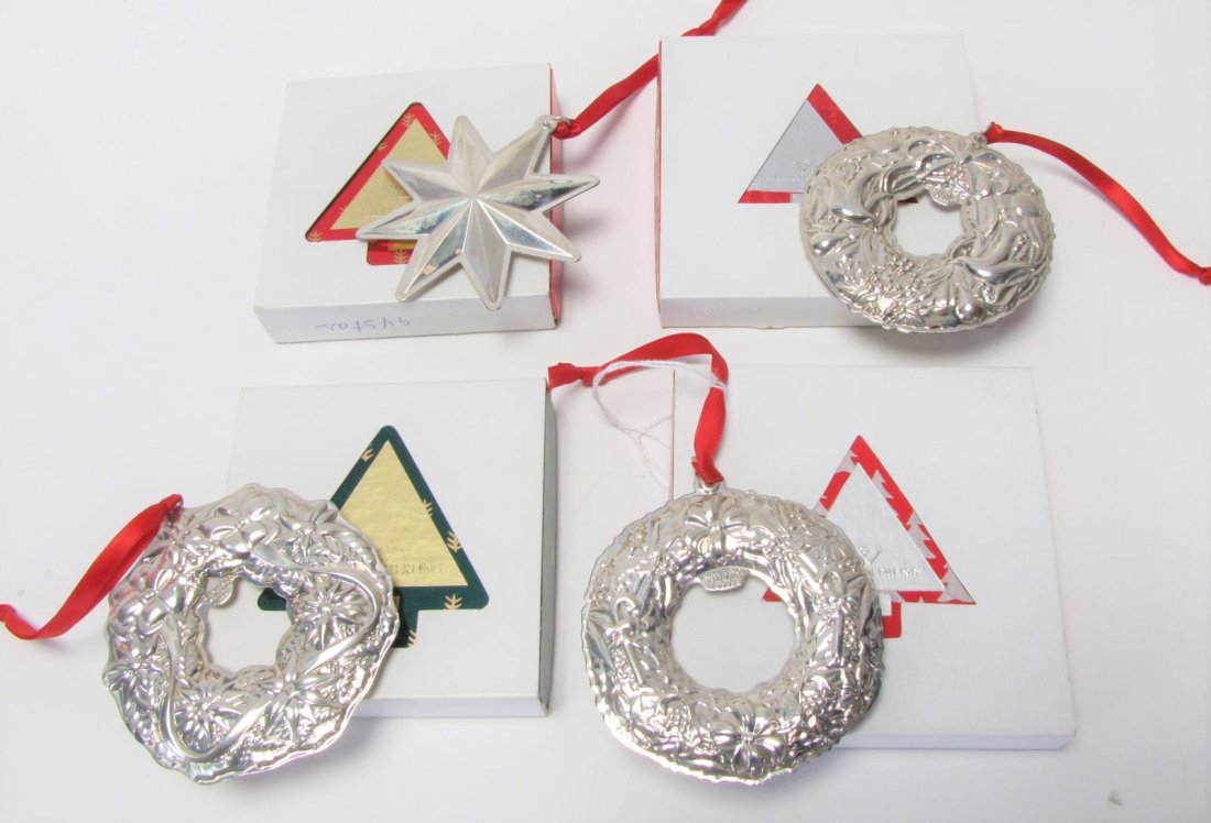 Four Wallace Sterling Annual Ornaments: Four Wallace sterling annual ornaments, including 1994 Christmas star; 1997 wreath; 1999 wreath; 2000 wreath; all with original boxes, 3.25" - 3.5" long