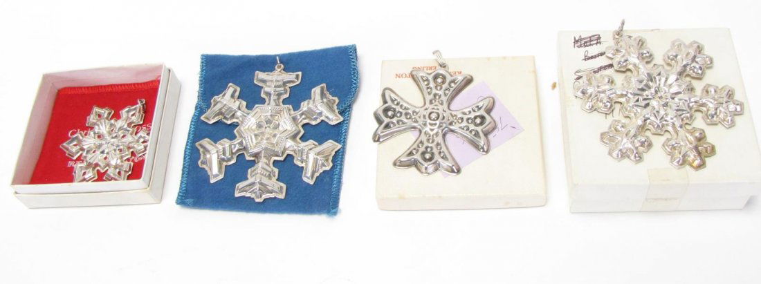 Four Gorham and Reed & Barton Sterling Ornaments: Four Gorham and Reed & Barton sterling ornaments, three Gorham including a sterling snowflake, 1976 snowflake and 1977 snowflake; and a 1975 Reed & Barton Christmas cross (with original box); 2.5" - 3