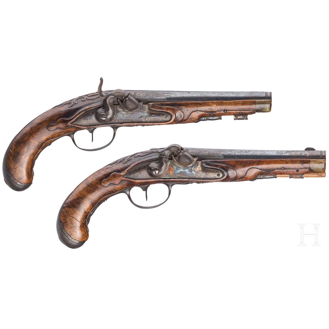 A pair of percussion pistols, German, c. 1780: BuntgehÃ¤rtete, achtkantige, in rund Ã¼bergehende LÃ¤ufe mit glatten, matten Seelen im Kaliber 12 mm, ein Korn abgebrochen. PerkussionsschlÃ¶sser mit erneuter BunthÃ¤rtung, eins mit gebroche