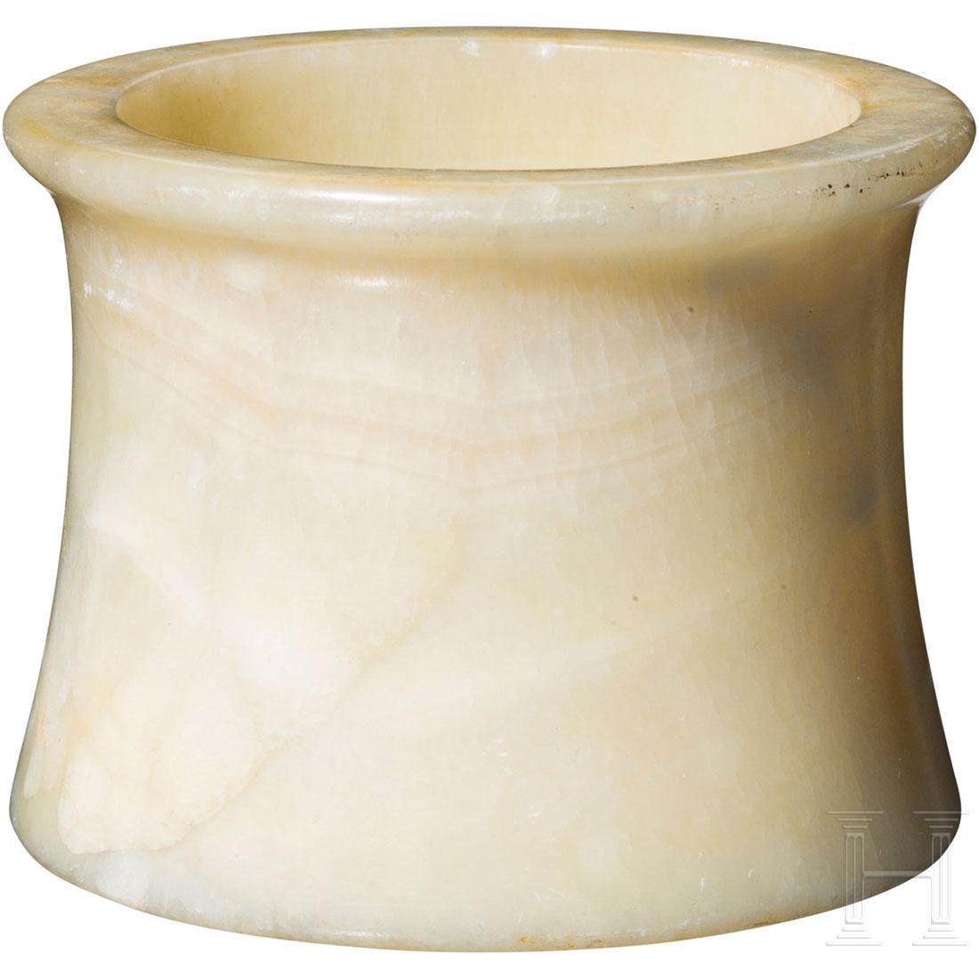 A Bactrian alabaster vessel, 2nd century B.C.: Alabaster vessel with a slightly conical body and a protruding lip. Beautiful patina. Intact. Diameter 8.2 cm. Height 6.4 cm. Provenance: From a private collection in southern Germany. Acquired in the
