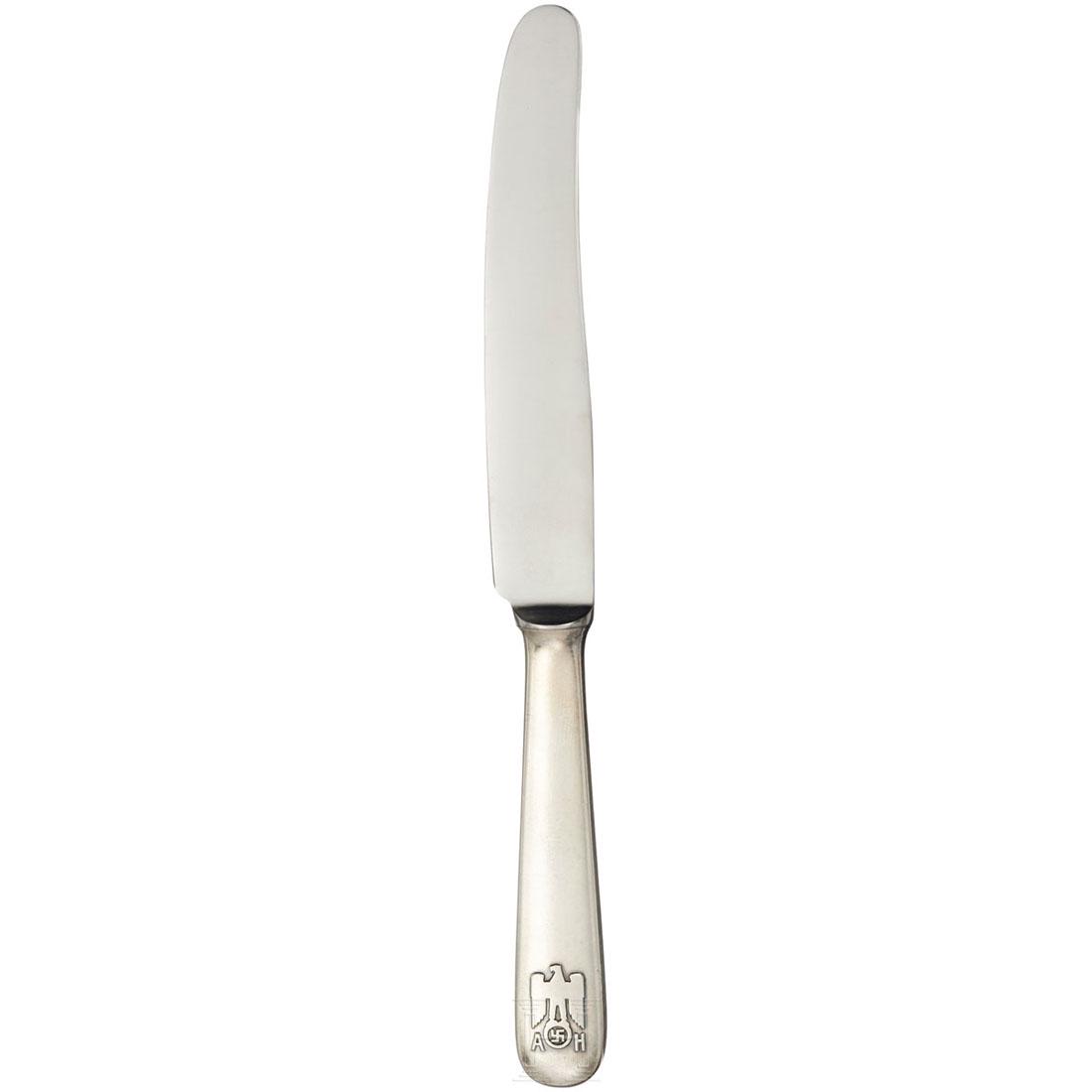 Adolf Hitler - a Lunch Knife from his Personal Silver: So called "informal pattern" with raised national eagle and the initials "AH" on the handle. Marked "Nicht rostend" and "W" on the blade, handle stamped "800" next to crescent, crown and eagle. Length