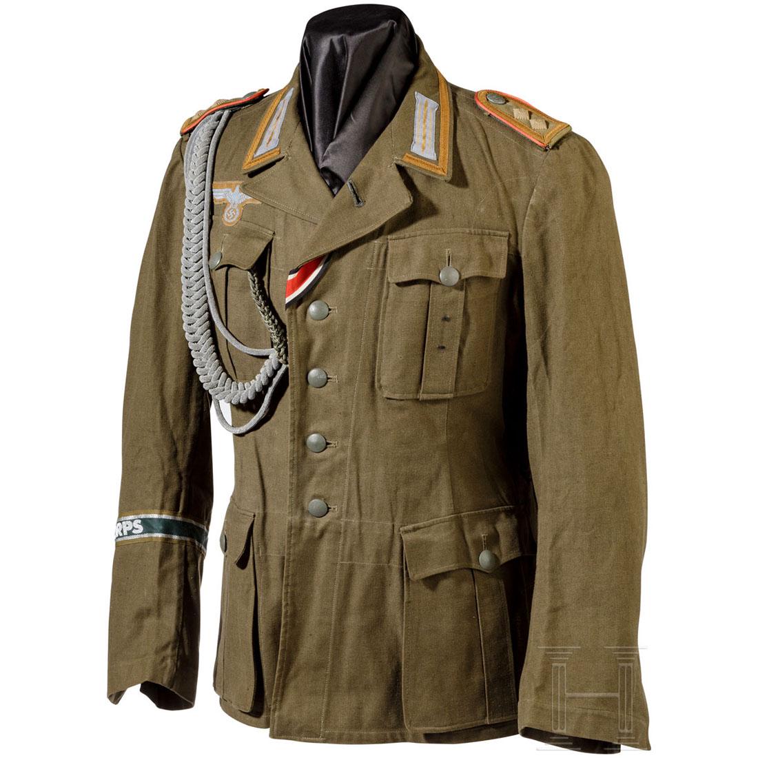 Tropenfeldbluse M 41 fÃ¼r Mannschaften/Unteroffiziere: KammerstÃ¼ck aus olivfarbenem Baumwollleinen mit einer TeilfÃ¼tterung aus dÃ¼nner Baumwolle, darauf Hersteller- und GrÃ¶ÃŸenstempel des MÃ¼nchner Bekleidungsamtes von 1941. Neuzeitlich ver