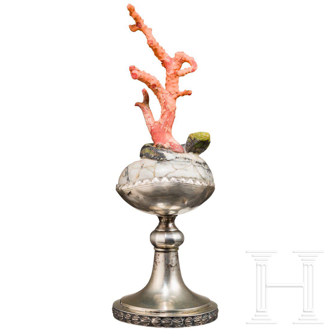 An Italian silver mounted red coral, 19th century: On silver stand, stamped with hall and marker's mark, mounted on a round piece of marble with a finely sculptured saurian and a red coral in shape of a tree. Smaller traces due to age. Height 21 cm. C