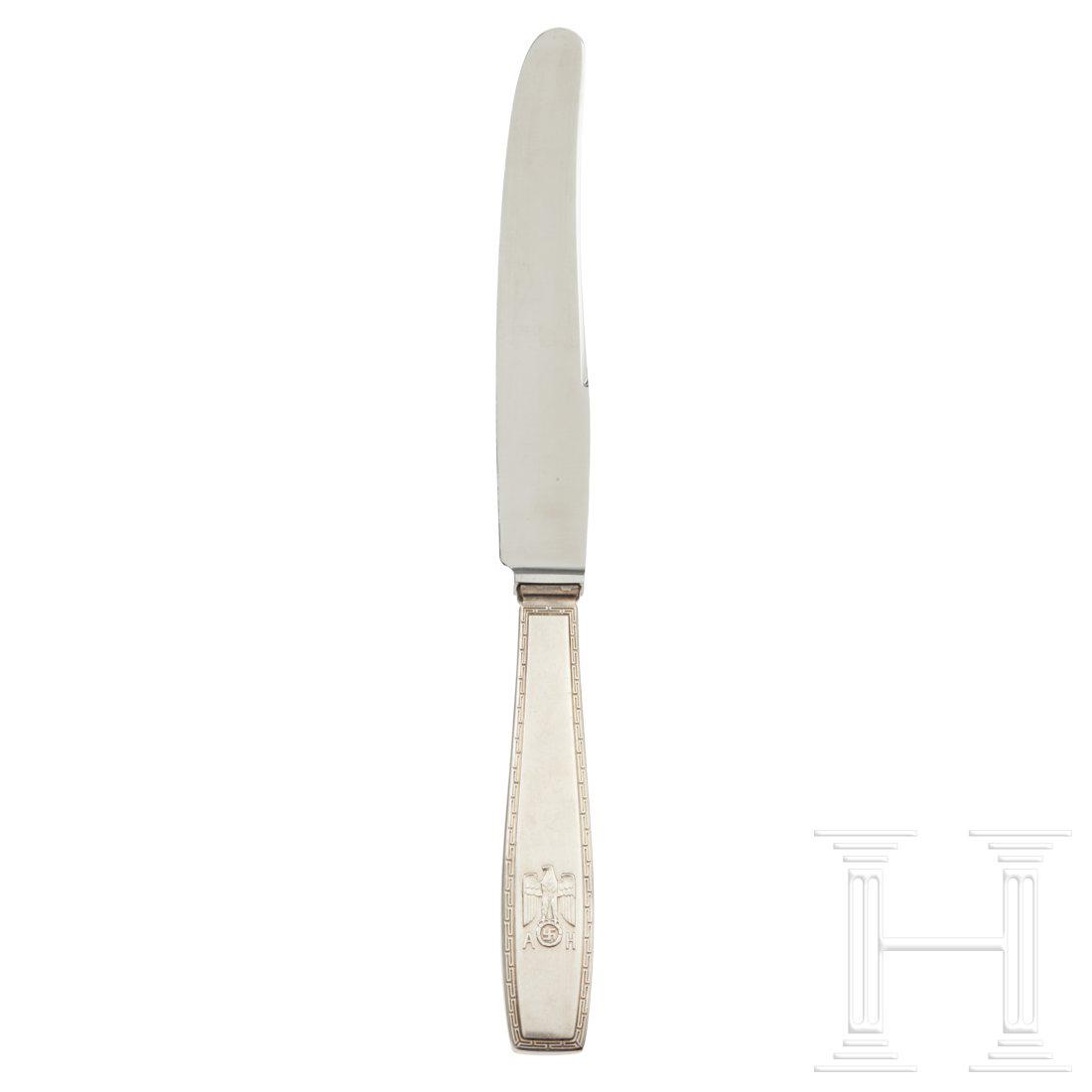 Adolf Hitler â€“ a Dinner Knife from his Personal: So called â€œformal pattern” with raised national eagle, the initials â€œAH” and continuous Greek key pattern along edges. Reverse stamped â€œ800” next to crescent, crown