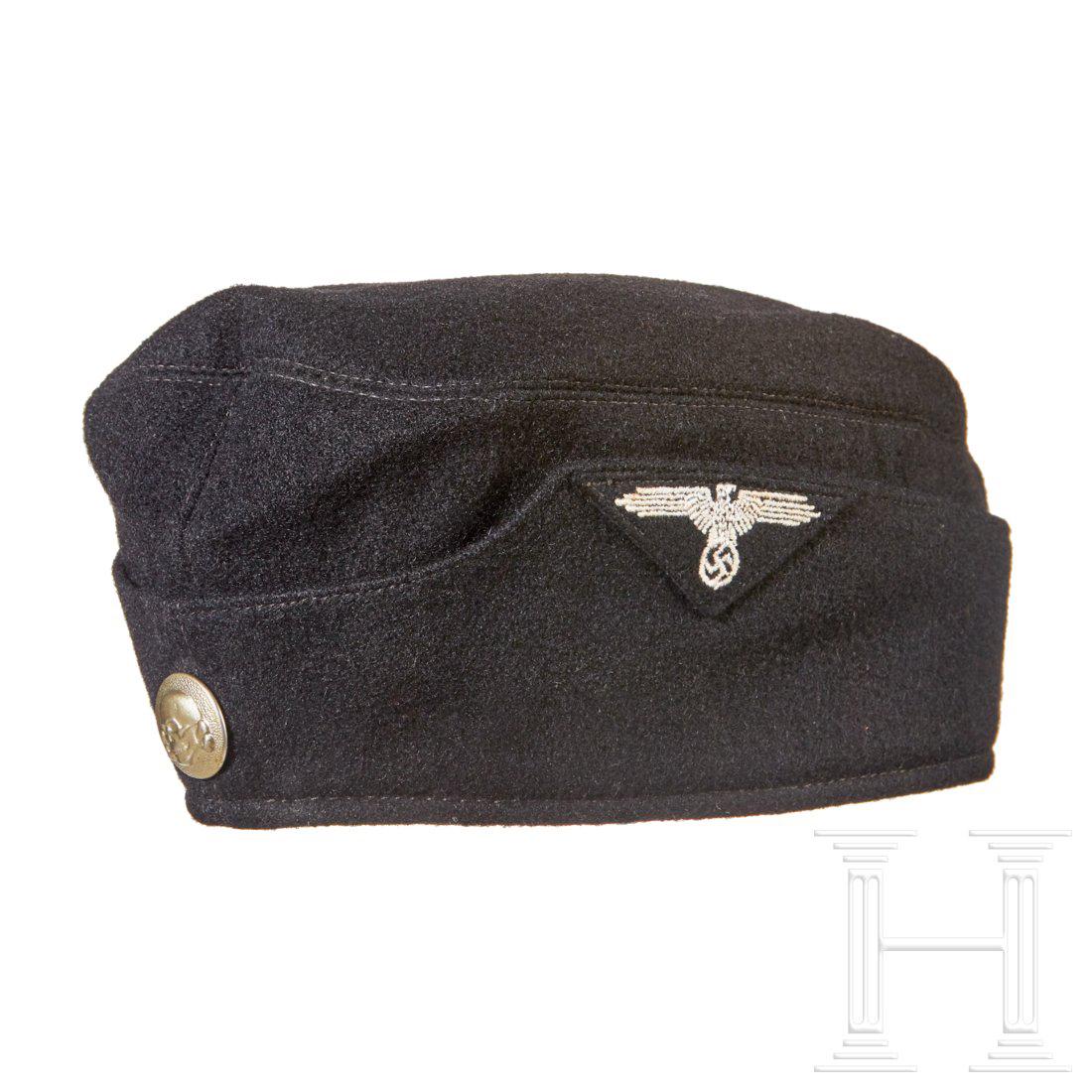 Allgemeine SS garrison cap for enlisted men of SS/SS VT: Black wool with ribbed black cotton lining, stamped size â€œ56” and â€œVA 1938”. Black oil cloth RZM label, silver skull button, machine-applied trapezoid eagle. Attention: USA-lot