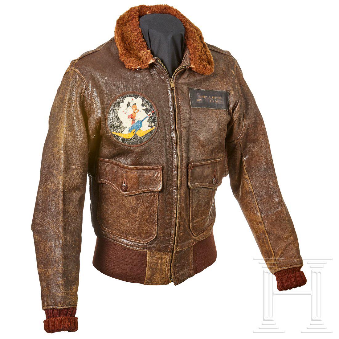 A USN Flight Jacket for Aviation Personnel: Brown leather type AN-J-3A jacket with fur collar and knit fabric elastic sleeves, "SERVAL" front zip fastener and elastic waistband closure, two hip patch pockets with button closure. Lined in light 