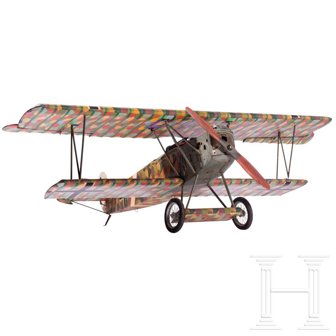 A detailed model of a Fokker D VII: Body and wings covered with cloth, camouflage painting and roundel. The interplane struts made of brass. A dummy engine with a wooden propeller, diameter 46 cm. Cockpit with nice instrument design, co