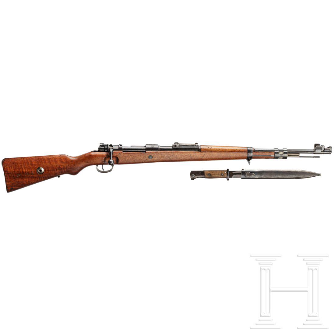 A carbine 98 k M 1937 by Mauser, with bayonet: Kal. 8x57 IS, Nr. D11821, nummerngleich inkl. Schrauben. Spiegelblanker Lauf. FÃ¼nfschÃ¼ssig. Dt. Beschuss. Fertigung Mauser-Werke A.G. Oberndorf. Div. Abnahmen Adler/63. HÃ¼lsenkopf mit portugi