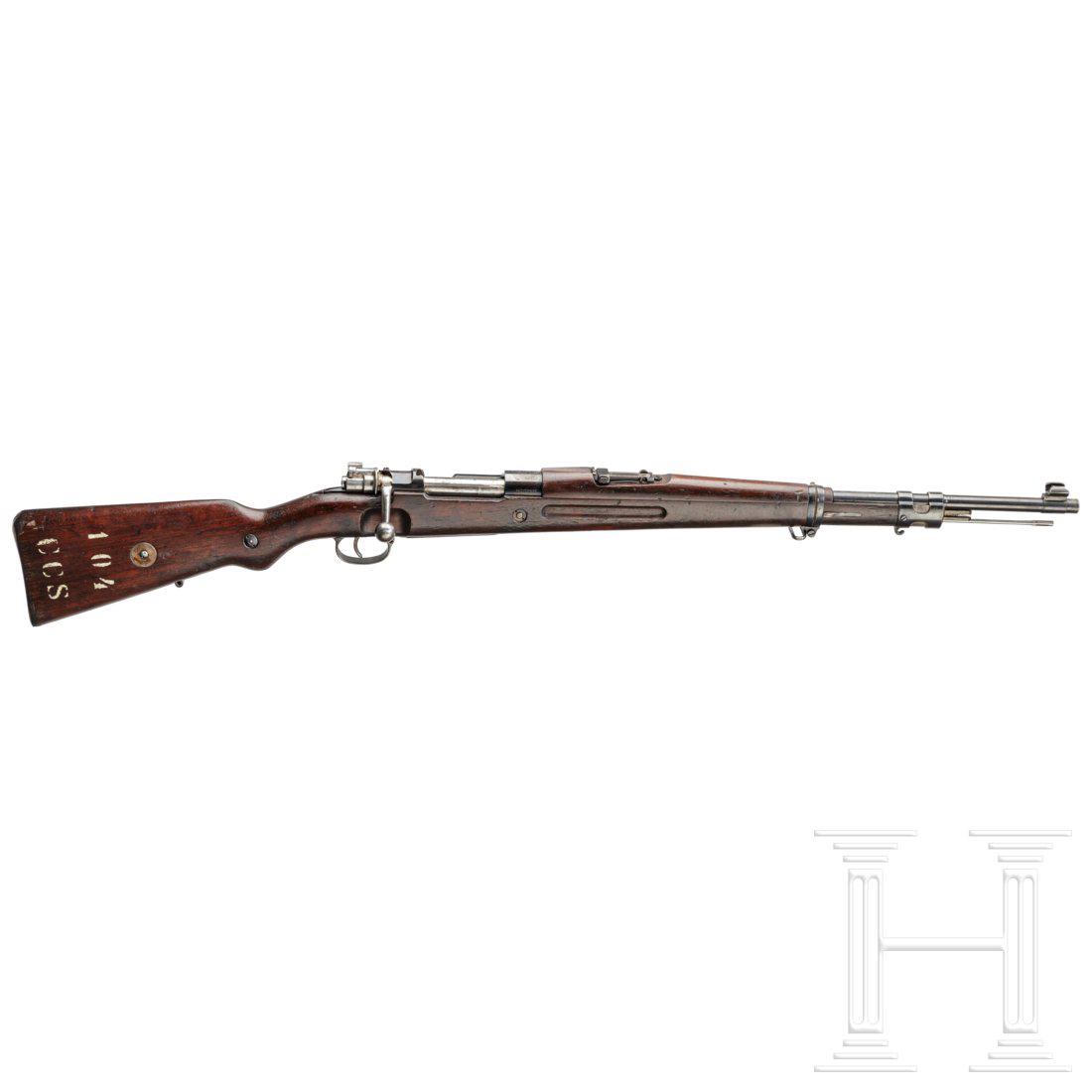 An M 1935 carbine for Brazil by Mauser: Kal. 7x57, Nr. 1644, Nummerngleich. Blanker Lauf. FÃ¼nfschÃ¼ssig. Beschuss Krone/BUGN. Visier skaliert 2 - 14. HÃ¼lsenkopf mit brasilianischem Wappen und Umschrift, rechts "Mod. 1935", an der F�