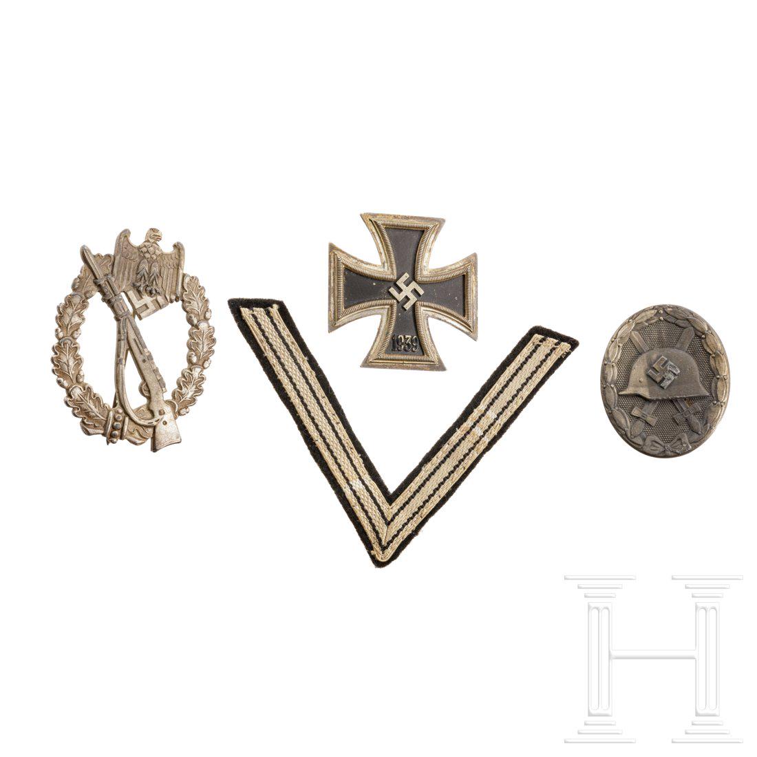 Drei Auszeichnungen: EK 1 (magnetisch, punziert "15", GegenhÃ¤kchen nachgelÃ¶tet), ISA in Silber ("CW") und VWA in Silber ("4"). Dazu ein neuzeitlicher (made after 1945) Winkel fÃ¼r Alte KÃ¤mpfer. Condition: II -