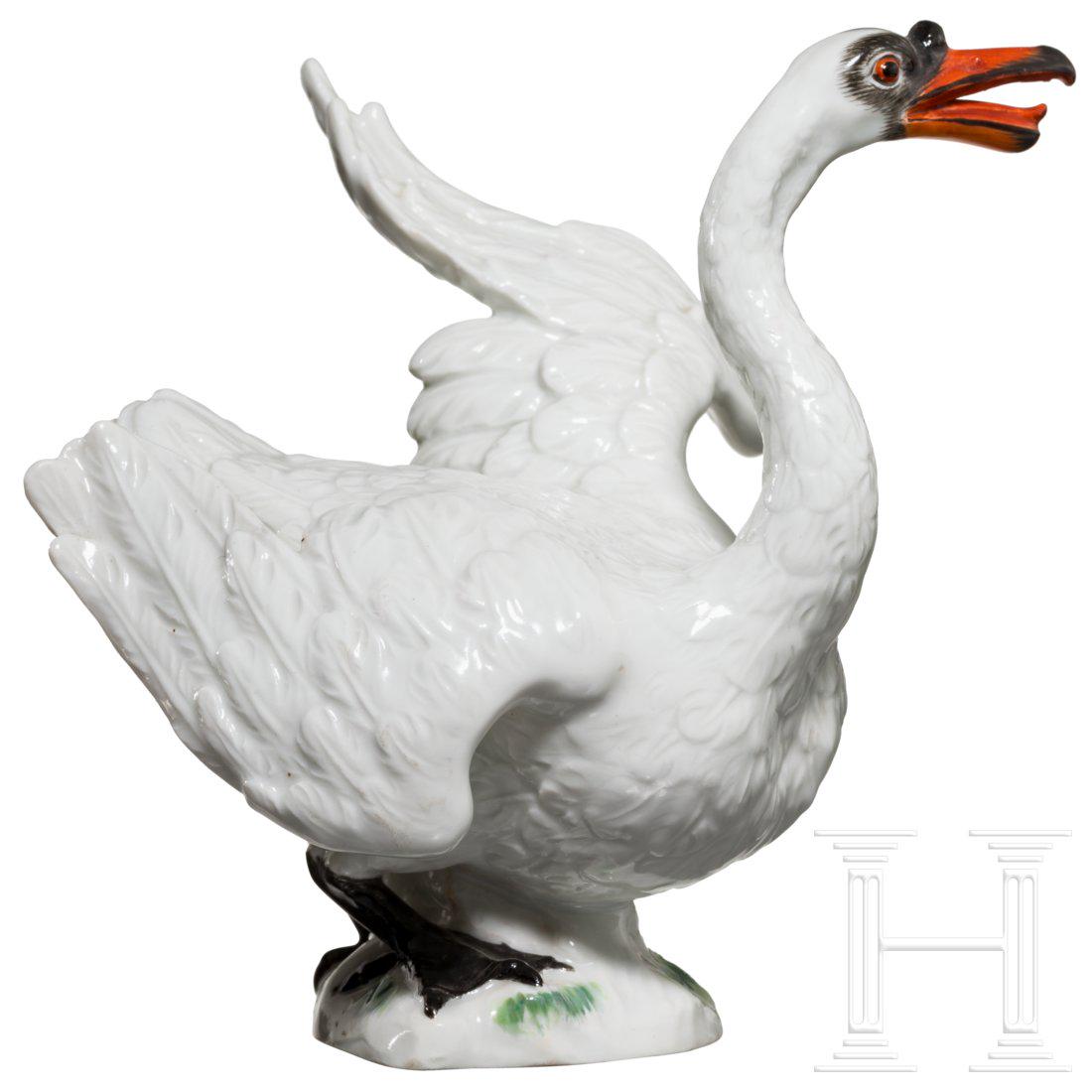 An elegant porcelain swan, Meissen, probably 19th: Naturalistically shaped swan, partially polychrome-trimmed. Blue underglazed sword mark and model number on the bottom. Height 12 cm. Minimal signs of age. Very good condition.Condition: I