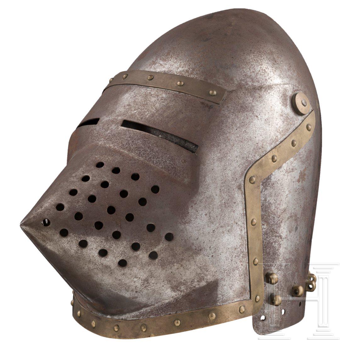 A bascinet, in the style of the early 15th century: Two-piece skull rising to a point at the rear. The edge pierced for a lining and studded with brass vervelles for attaching an aventail, and fitted with pivoted hinges at the sides. The visor formed w