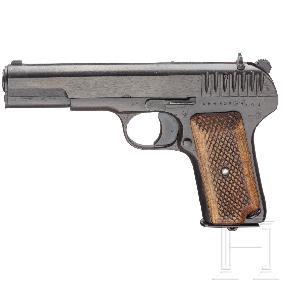 A Tokarev TT 33 with holster and Magazines with: Cal. 7,62 mm Tok., SN. AK 1302, Kal. 7,62 mm Tok., Nr. AK 1302, Ã¤uÃŸerlich nummerngleich. Blanker Lauf. AchtschÃ¼ssig. Dt. Beschuss. Fertigung 1943. Originale BrÃ¼nierung auf unpolierter Ober