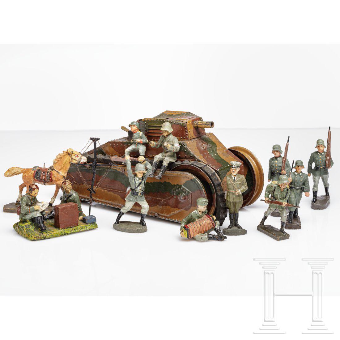 A Maerkin tin tank and Elastolin toy soldiers with: Partly damaged, repainted - "restored".Condition: II - III