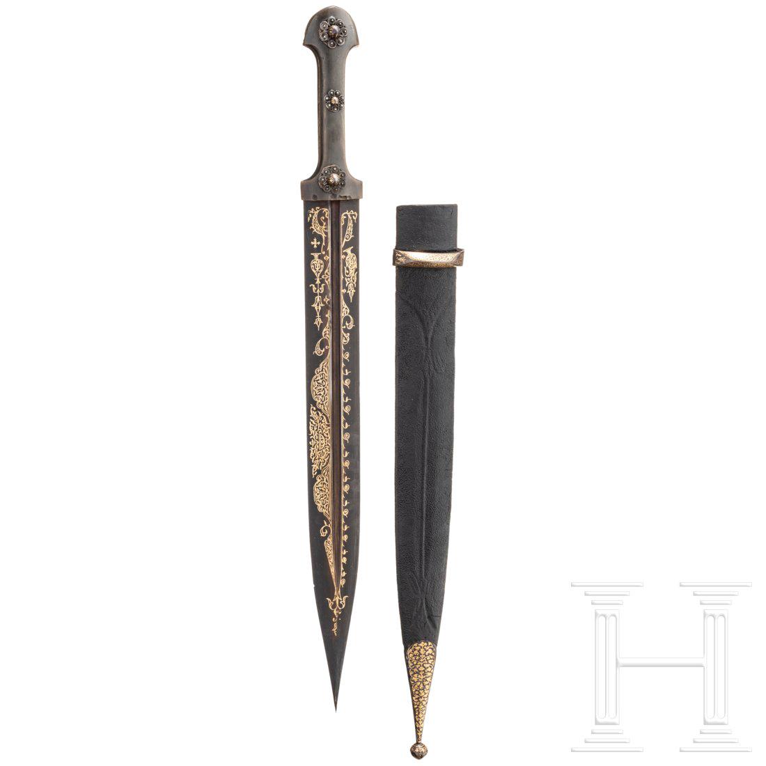 A gold-damascened Caucasian kindjal, 2nd half of the: A gold-damascened Caucasian kindjal, 2nd half of the 19th century Zweischneidige Klinge mit beidseitiger, leicht versetzter Kehlung und originaler BrÃ¼nierung. Schauseitig reicher goldtauschierter D