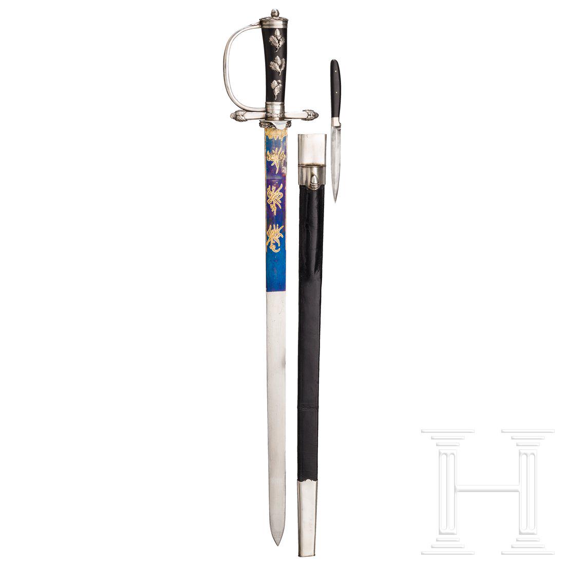 A German silver-mounted courtly hunting hanger, circa: A German silver-mounted courtly hunting hanger, circa 1840 Sturdy, single-edged blade with a double-edged point, a gilt ornament on a blued background etched onto both sides of the upper third. Silver