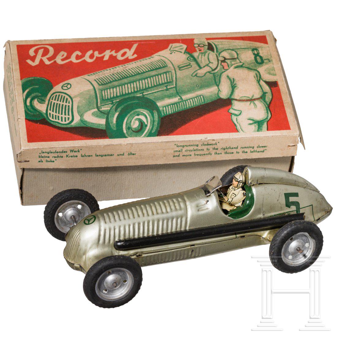 A JNF Neuhierl Mercedes racing car model Silberpfeil in: JNF (Josef Neuhierl FÃ¼rth), Mercedes-Rennwagen Silberpfeil, 30er Jahre, BlechausfÃ¼hrung, bedruckt, Uhrwerkantrieb gut, AufziehschlÃ¼ssel, LÃ¤nge ca. 20 cm, mit Fahrerfigur und Startnummer f�