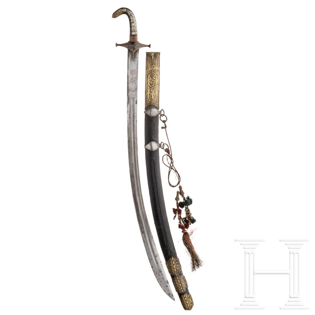 A Persian shamshir, 19th century: A Persian shamshir, 19th centuryBreite Klinge aus Wootzdamast, beidseitig eine Hohlkehle sowie ein rÃ¼ckennaher Zug, terzseitig goldeingelegte Schriftkartusche unter Halbmond und Stern (Einlagen feh
