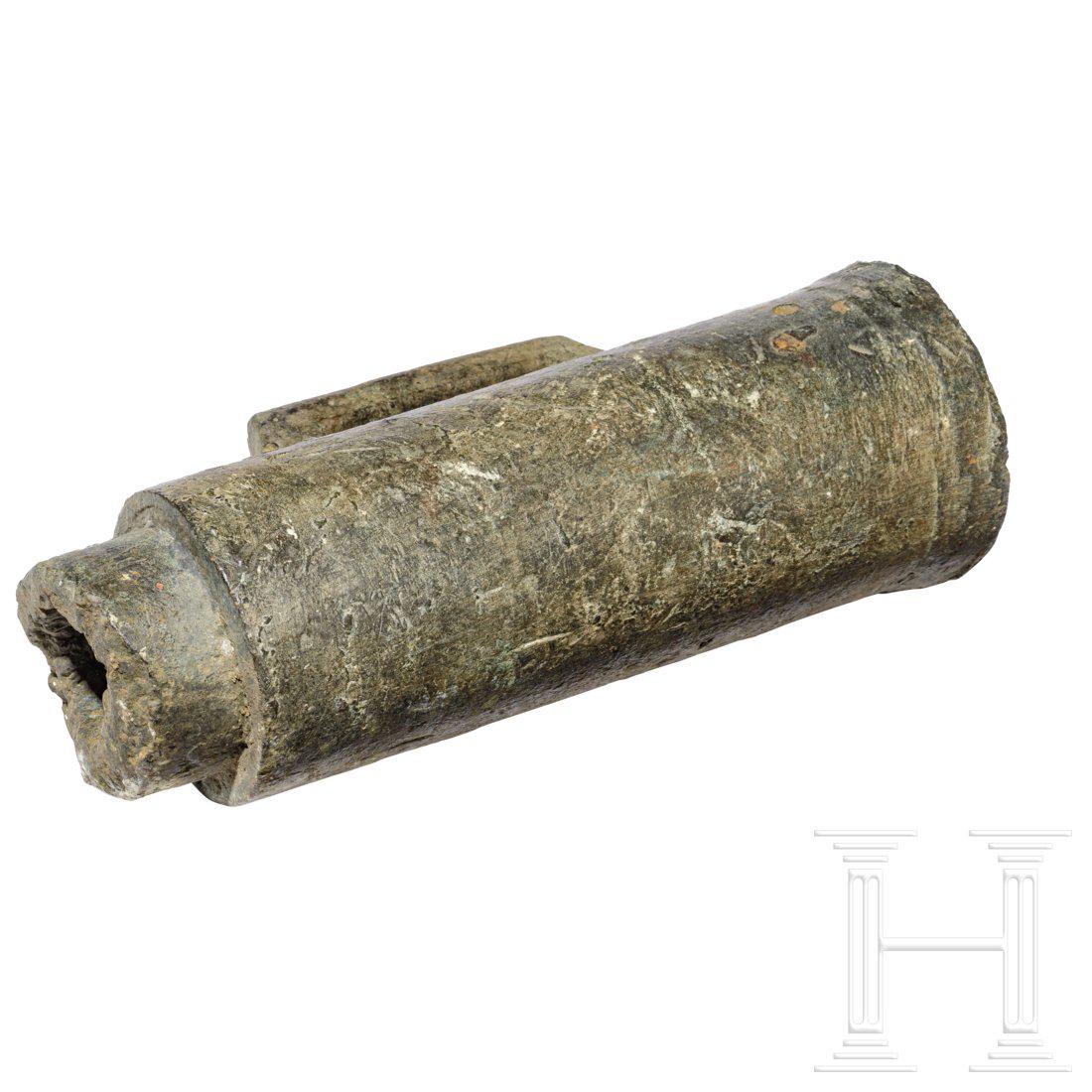 A chamber for a German breech-loading cannon , 16th: A chamber for a German breech-loading cannon , 16th centuryMug-shaped chamber made of bronze, with reinforced bottom, tapered front-end, touch hole. Burst open at the side, with a piece missing. Lengt