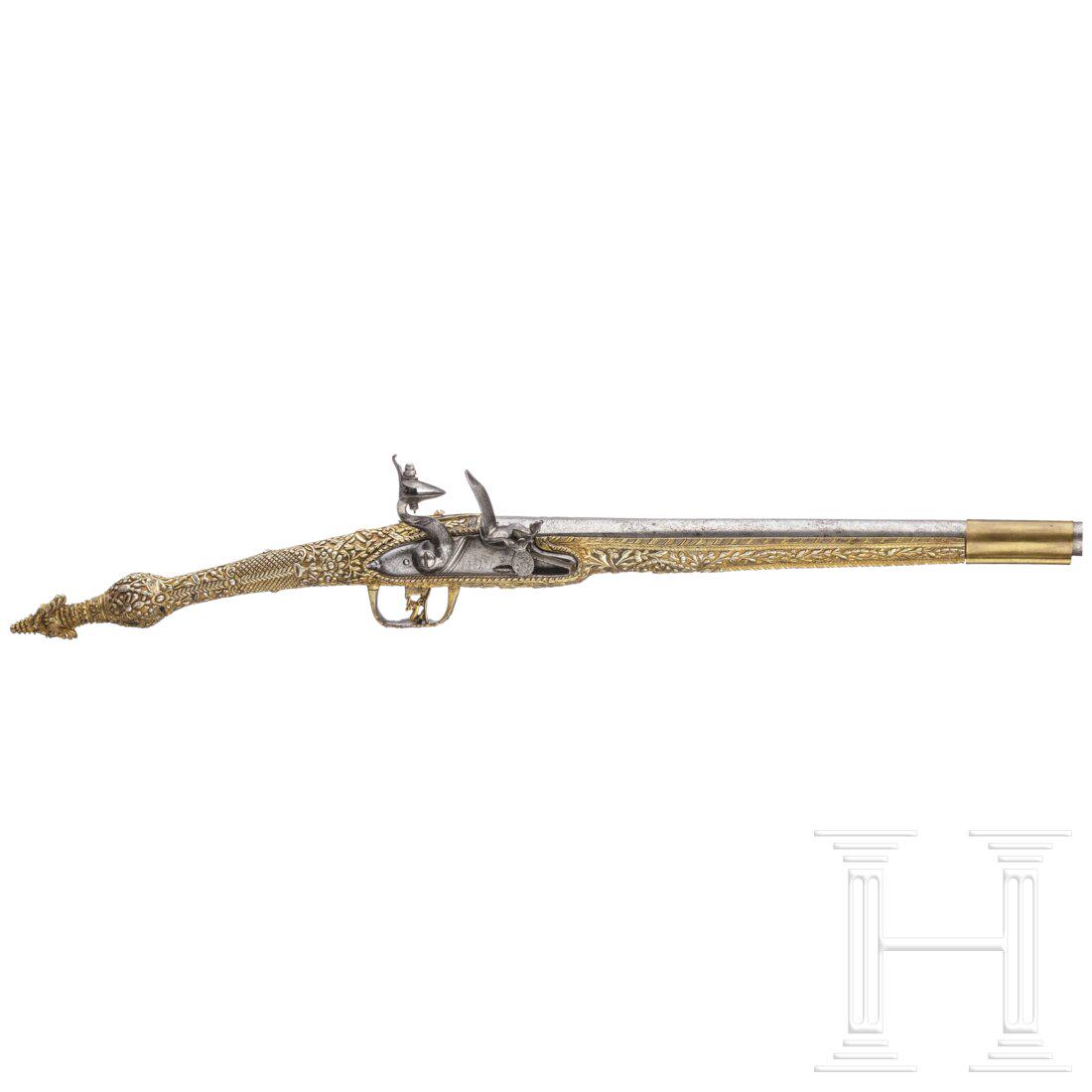 A magnificent Ionian flintlock pistol, ca. 1820: A magnificent Ionian flintlock pistol, ca. 1820The smooth-bore barrel in 14.5 mm calibre, numerous brass-lined marks struck at the breech. The smooth flintlock with a domed lock plate, bearing a pseud