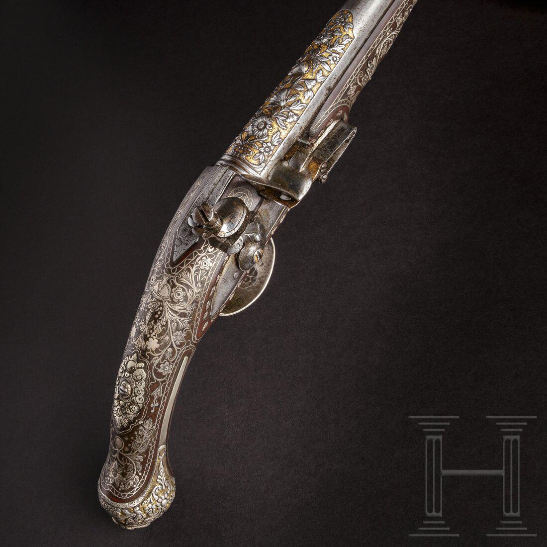 A luxury flintlock pistol for the oriental market,: A luxury flintlock pistol for the oriental market, Robert Wilson, London, circa 1770Round barrel, cal. 17 mm, smooth bore, length 210 mm. The breech end of the barrel decorated with intricately chisel