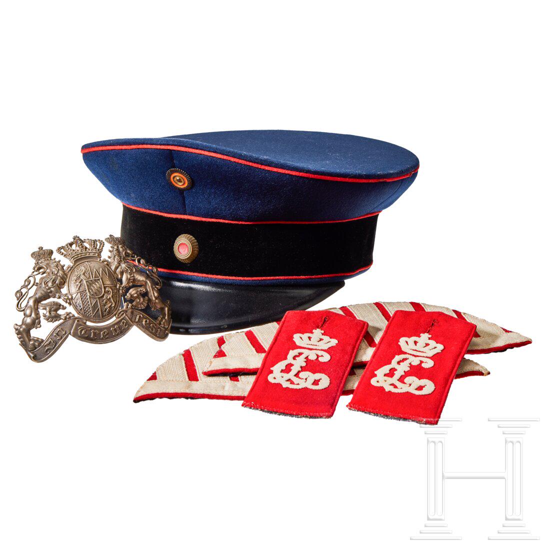 A visor cap and assorted insignia (1 of 16)