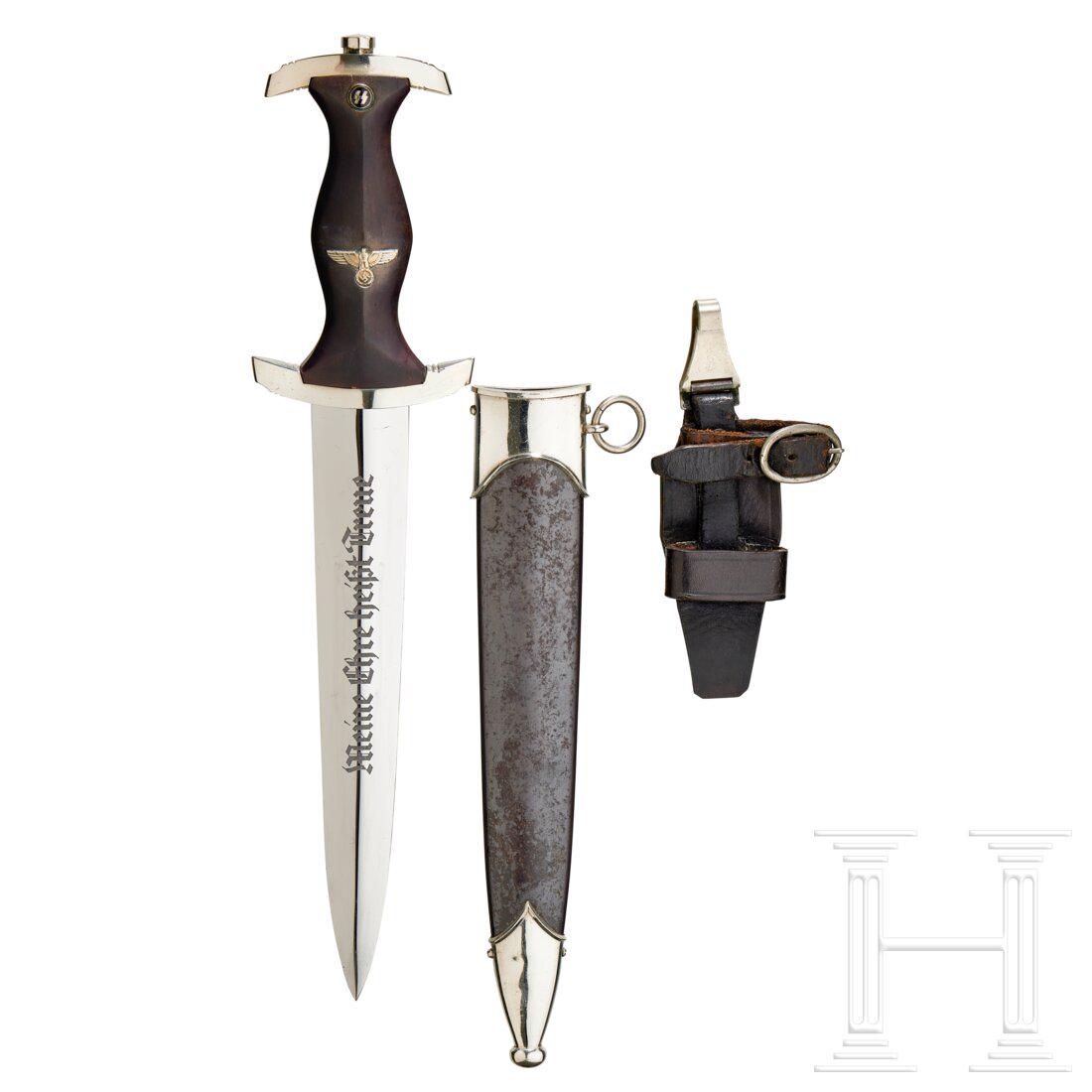 A Model 1933 SS Service Dagger: A Model 1933 SS Service Dagger Maker Robert Klaas, Solingen. Polished steel blade, exhibits age with etched motto and maker logo. Nickel-silver grip fittings, lower reverse cross-guard punched “