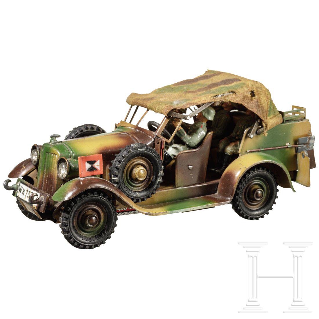 A Hausser Wireless Signal Corps Kuebelwagen "WH 73312",: A Hausser Wireless Signal Corps Kuebelwagen "WH 73312", camouflage, with Elastolin soldiersHausser-Elastolin, Blech-Masseausführung, 7 cm-Serie, 30er Jahre: Nachrichten-Kübelwagen, 733/12, m