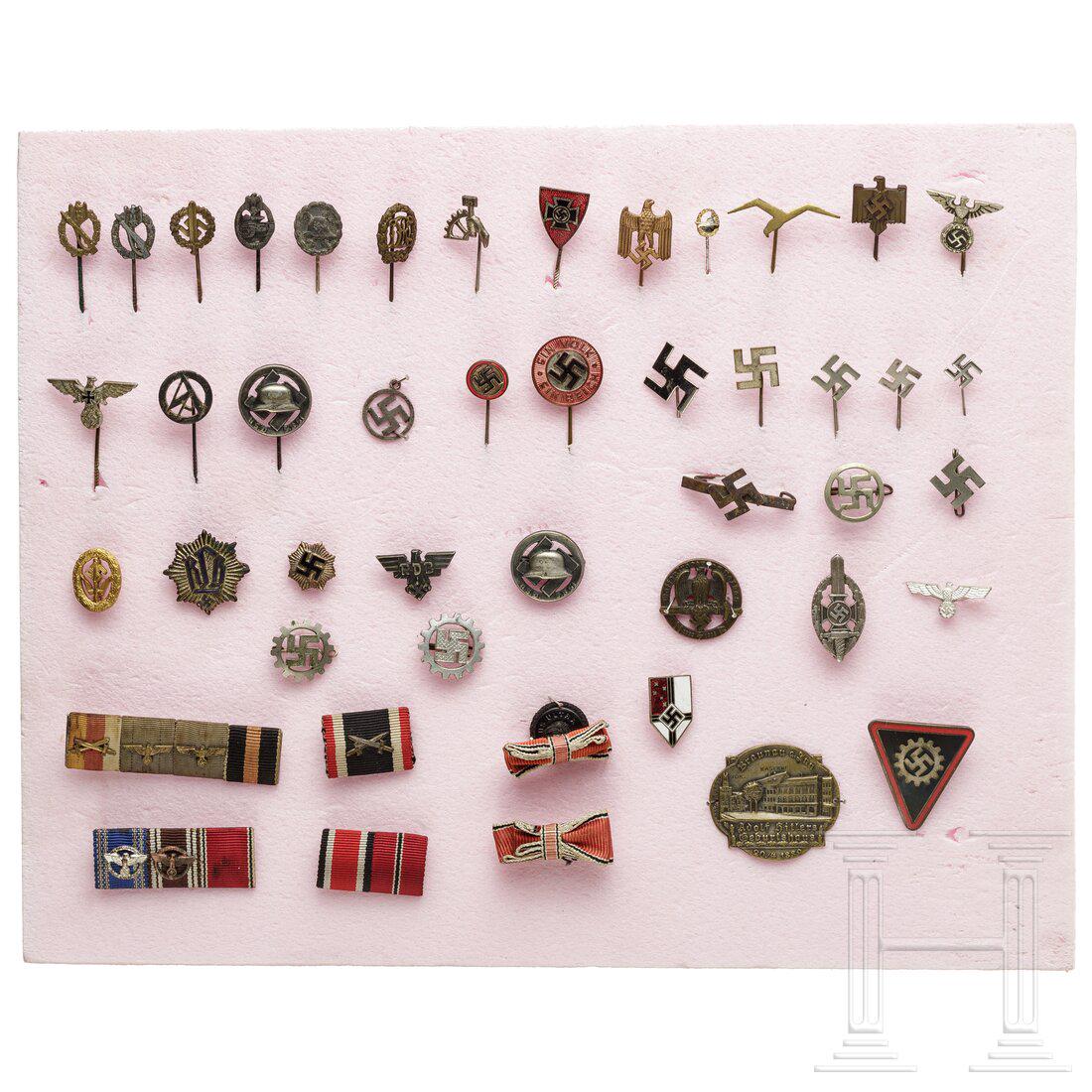 A small group of badges and miniatures: A small group of badges and miniatures16-mm-Miniaturen von Sturm- und Sportabzeichen, Mitgliedsnadel u.a. von Partei, SA, RDB, NSKOV, DAF, RLB, Sympatieabzeichen, Feldspangen, ein Stocknagel des Gebur
