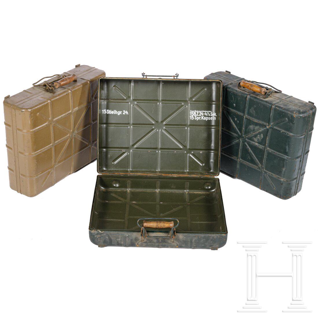 Three transport boxes for the M 24 stick grenade: Three transport boxes for the M 24 stick grenade Jeweils außenseitig überlackierte Blechkästen, teils flugrostig, alle ohne Innenausstattung. Condition: II - III