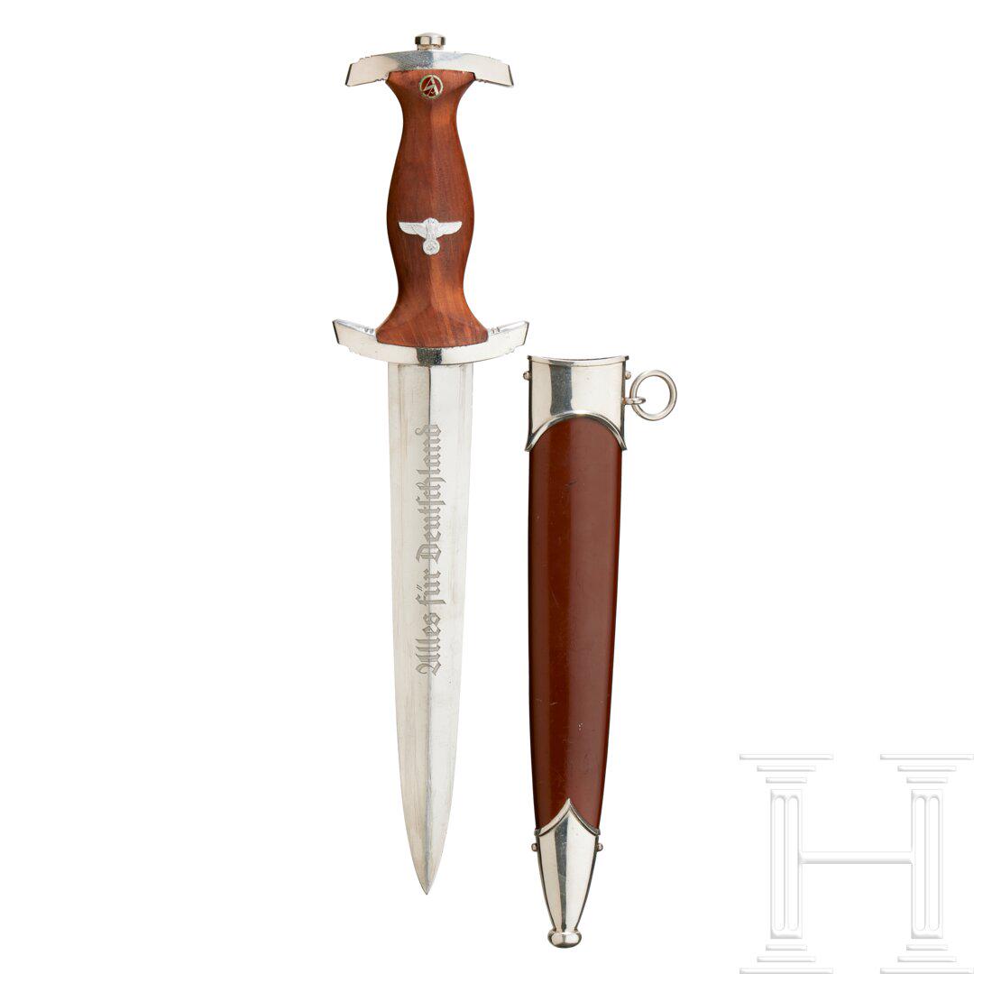A Model 1933 SA Service Dagger: A Model 1933 SA Service Dagger Maker 1198/39, polished steel blade, exhibits age with etched motto and manufacturer’s RZM marking. Nickel-silver grip fittings and lower reverse cross-guard. Brown wo